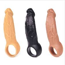 Three silicone sex toys in different colors on a white background